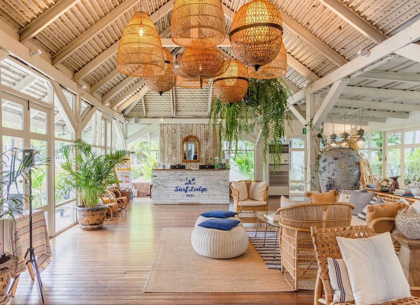 The Peri Hotel Hua Hin in Hua Hin: airy lobby with wicker seating, hanging lanterns and plants