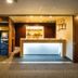 Super Hotel Inn Sendai Kokubuncho lobby with self-service check-in kiosks and illuminated front desk in Sendai