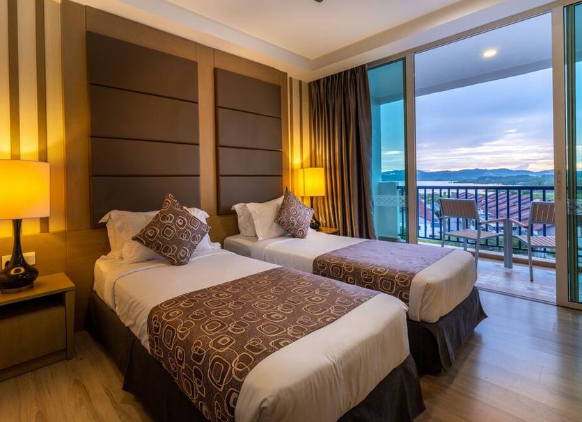 Dayang Bay Resort Langkawi room with twin beds and balcony overlooking the water in Langkawi