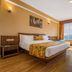 Summit Namnang Courtyard & Spa, Gangtok room with king bed and large window overlooking the mountains