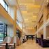 Shenyang Neu International Hotel lobby in Shenyang with tall ceilings, lounge seating, and large windows