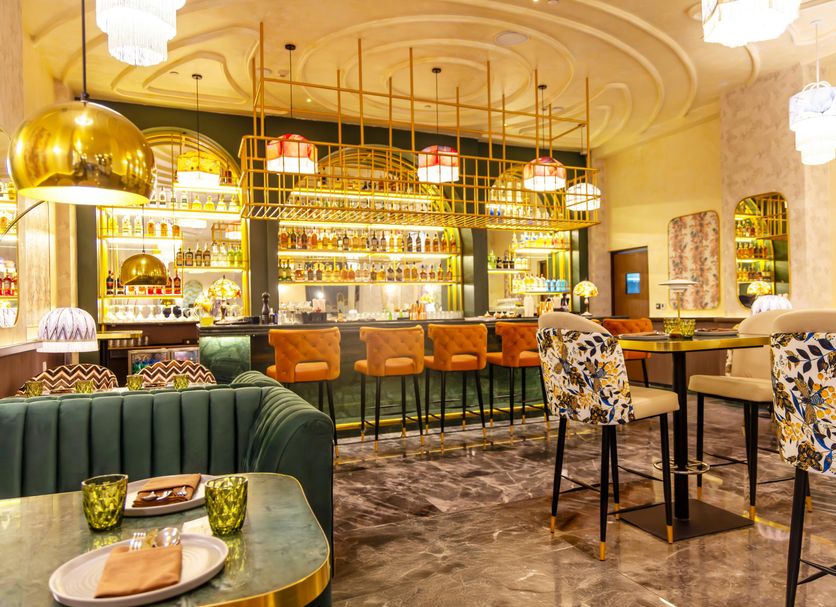 DoubleTree Suites by Hilton Bengaluru Outer Ring Road bar and lounge with high stools and gold pendant lights