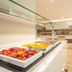 Niriides Beach in Kolympia with a bright buffet breakfast spread and modern dining area