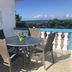 The Beach Guesthouse in La Torre: seaside terrace with table, chairs and ocean view