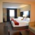 Holiday Inn Express & Suites Waterford guest room with two beds and seating area