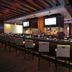 Four Winds Casino Resort in New Buffalo features a sleek bar with high stools and illuminated screens.