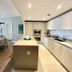 Lyfe Resort And Residences Hollywood suite with kitchen island and dining area