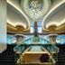 Tui Magic Life Jacaranda lobby with grand staircase, chandelier, and central Christmas tree in Side
