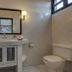 Hotel Maya del Mar Playa del Carmen bathroom with vanity, sink, mirror, toilet and window