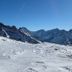 Le Cairn in Les Deux-Alpes with snowy alpine mountain and ski slope views