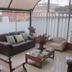 Hotel Casa Lamay Bogotá terrace lounge with sofa, armchairs, coffee table, and potted flowers