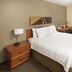 TownePlace Suites by Marriott Salt Lake City Layton guest room with bed, desk, TV and window in Layton