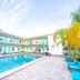 Uptown Inn & Suites in St. Petersburg courtyard pool with two-story exterior and lounge chairs