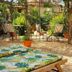 Bed and Breakfast Rosangela in Taormina garden patio with lounge chairs and potted plants