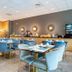 Residhotel Le Grand Prado Marseille breakfast room with blue chairs and buffet counter