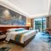 Anhui Construction New Era Hotel in Bengbu room with king bed, TV, desk and balcony view