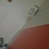 Ssaw Boutique Shanghai South Xuhui Riyue guest room with a wall lamp and side table in Shanghai