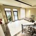 Yerevan Deluxe Hotel in Yerevan lobby with seating area, large windows and decorative wrought-iron railing