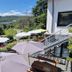 Pension Haus Diefenbach in Heimbach with terrace umbrellas and hillside valley views