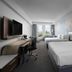 Courtyard by Marriott Delray Beach room in Coral Springs with two beds, desk, and city view