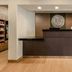 Fairfield Inn & Suites by Marriott Houston Westchase lobby front desk with warm lighting