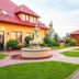 Hotel Wellness & Spa Nowy Dwór in Świlcza with a landscaped courtyard, fountain, and garden paths