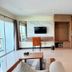 Phavina Hotel & Grand Boutique Rayong room with kitchenette, TV, desk, seating area and city view