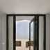 Zandpaviljoen Pier 7 in Vlissingen with open doors to a wooden deck and sea view