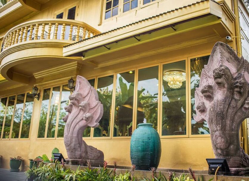 Nakaraj Princess Chiang Rai - Walking Street exterior with ornate balcony and large decorative sculptures