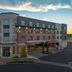 Homewood Suites by Hilton Portsmouth Downtown exterior at dusk with modern facade and covered entrance
