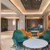 Orange Hotel Beijing Japan Medical University lobby seating area with teal and orange lounge chairs in Beijing