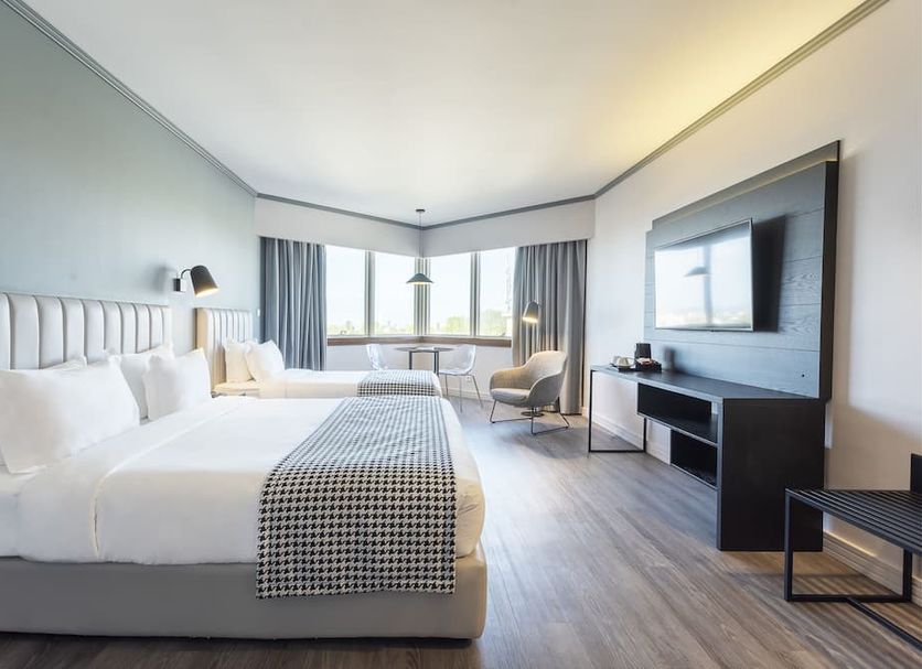 Hf Fénix Porto room in Porto with king bed, large TV, seating area and city-view windows