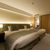 Hotel Nikko Tsukuba room in Tsukuba with twin beds and warm wood sliding doors