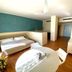 Hotel Del Golfo, Finale Ligure room with bed, round table and wood floors