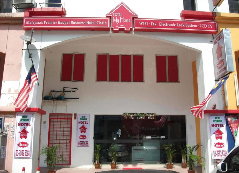 My Home Hotel Kuchai Lama in Kuala Lumpur, storefront with flags and red signage