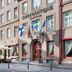 Savoy Boutique Hotel by TallinnHotels in Tallinn, exterior with flags and sidewalk café