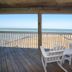 The Inn on Pamlico Sound in Buxton: ocean-view deck with Adirondack chairs overlooking the beach