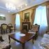 Park Hotel Zamkovy, Gomel: elegant lounge with ornate seating, chandelier, fireplace and tall windows