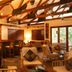 Ka'ana Resort San Ignacio lounge with bar, wood-beam ceiling, and seating area