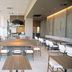Hotel Jal City Tsukuba dining area in Tsukuba with long communal tables and large windows