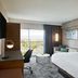 Courtyard by Marriott Los Angeles Sherman Oaks guest room with king bed, desk, balcony and mountain view