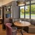 Courtyard by Marriott Dulles Airport Herndon/Reston lounge seating with large windows and booth tables