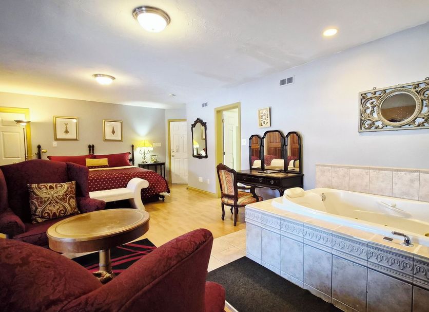 Auberge Wild Rose Inn in Moncton suite with whirlpool tub, seating area and vanity