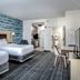 TownePlace Suites by Marriott Savannah Airport guest room with two beds, desk, and patterned carpet in Savannah