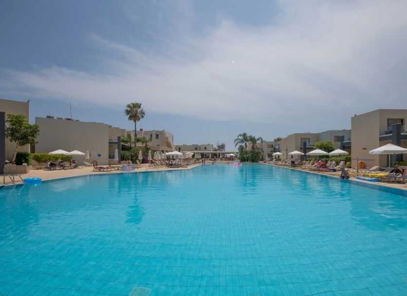 Electra Holiday Village Water Park Resort in Ayia Napa with a large outdoor pool and sun loungers
