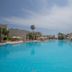 Electra Holiday Village Water Park Resort in Ayia Napa with a large outdoor pool and sun loungers