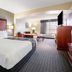 La Quinta Inn & Suites By Wyndham Dfw Airport South / Irving guest room with king bed and sitting area