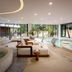 Secrets Tulum Resort And Beach Club indoor pool lounge with curved pool and garden views in Tulum