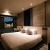 Hotel Jal City Nagasaki guest room with bed and city view in Nagasaki