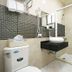 Hualien Dawan B&B in Hualien City bathroom with sink, toilet, shower, and sliding glass shower door